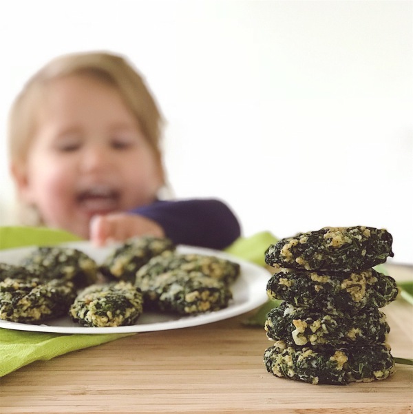Photo of child reaching for spinach bites