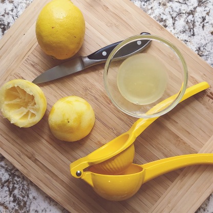 Photo of a lemon being juiced
